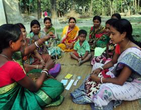 A rural health worker teaches women about the IUD and other contraceptive methods in remote Kushamandi, South Dinajpur, West Ben