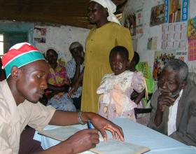 Field worker in Vihiga, Kenya registers HIV/AIDS orphans © 2006 Xoli Mahlalela, Courtesy of Photoshare