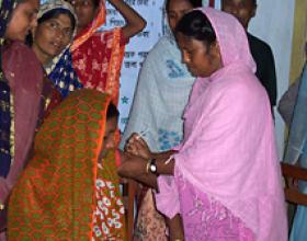 A health worker administers a Somazet injection for family planning at a community health clinic