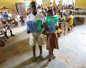 Addo and Festus, students at Amanhyia Catholic School in Ghana, receive long-lasting insecticide-treated bed nets (LLINs)