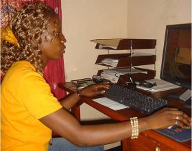 An adolescent female uses a computer in Sierra Leone. Src - © 2008 Veronica Thomas, Courtesy of Photoshare