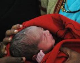 Infant being held