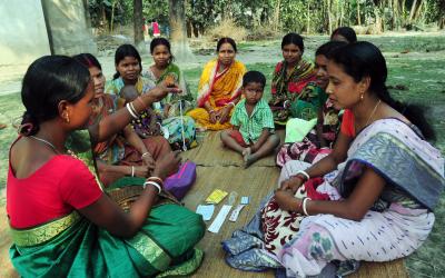 A rural health worker teaches women about the IUD and other contraceptive methods in remote Kushamandi, South Dinajpur, West Ben