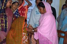 A health worker administers a Somazet injection for family planning at a community health clinic