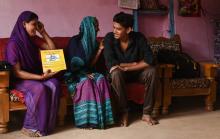 Source - © 2016 Arvind Jodha/UNFPA, Courtesy of Photoshare. Description - An Accredited Social Health Activist (ASHA) in India explains the various family planning methods to a couple, as the young bride shies away. 